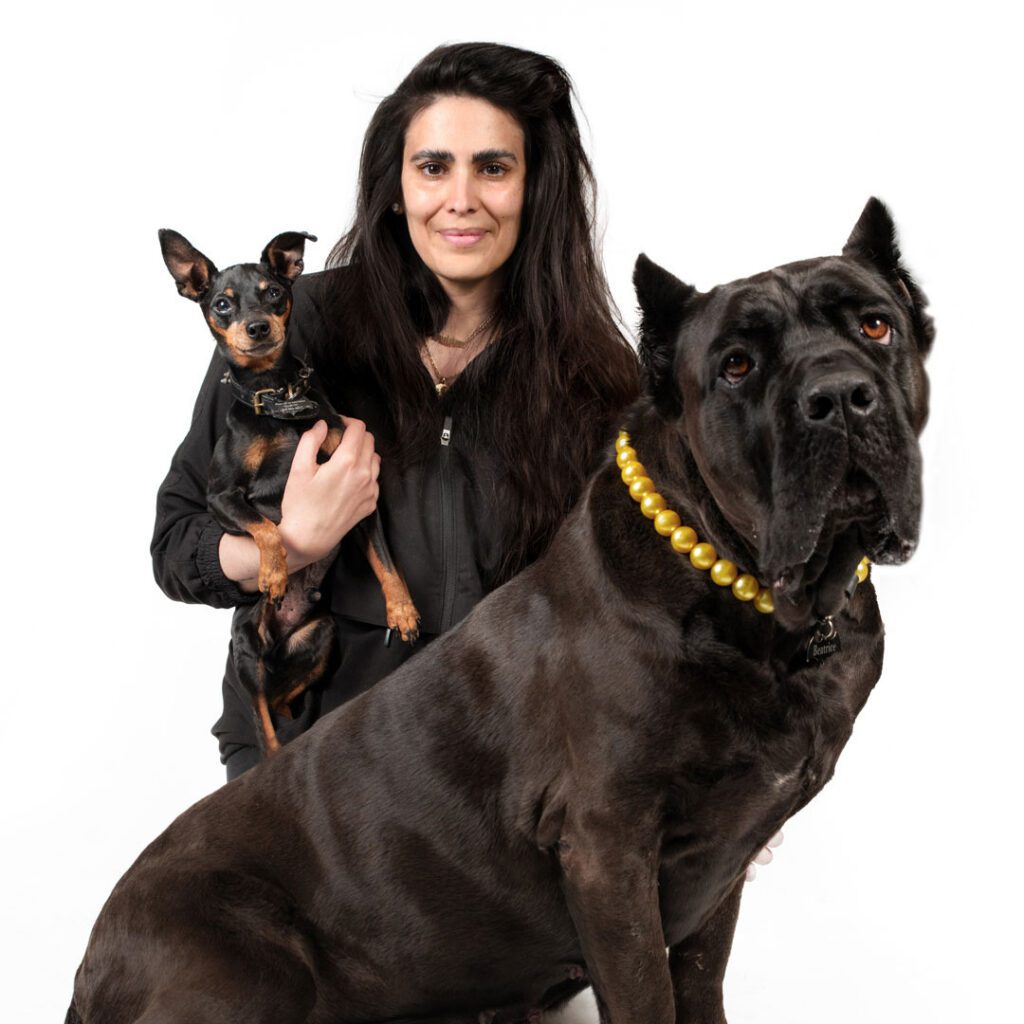 smiling woman with her two dogs